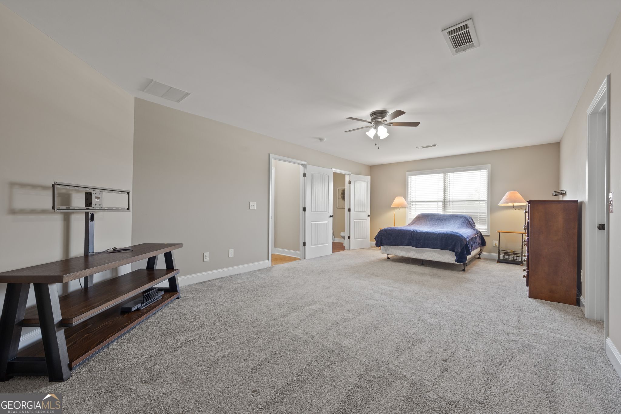 107 Sweet Bay Circle Milner, GA 30257 - Photo 26 of 31 a living room with furniture and a ceiling fan