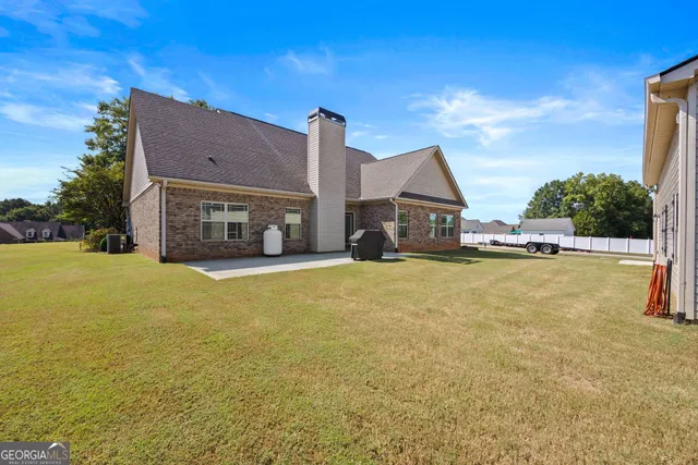 a living room with lots of furniture and a projector