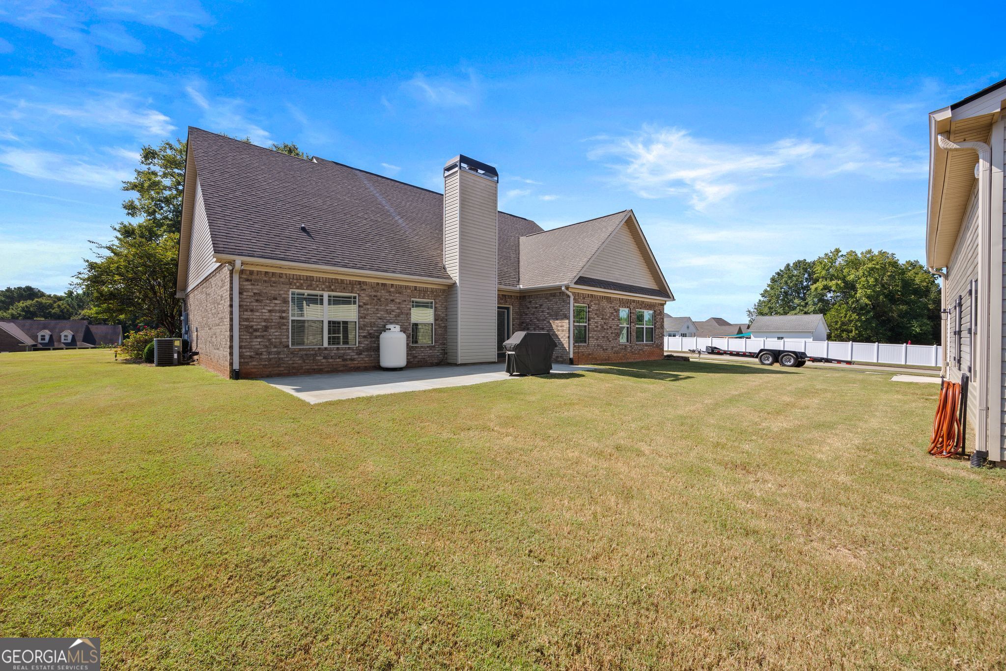 107 Sweet Bay Circle Milner, GA 30257 - Photo 30 of 31 a house view with swimming pool in front of it