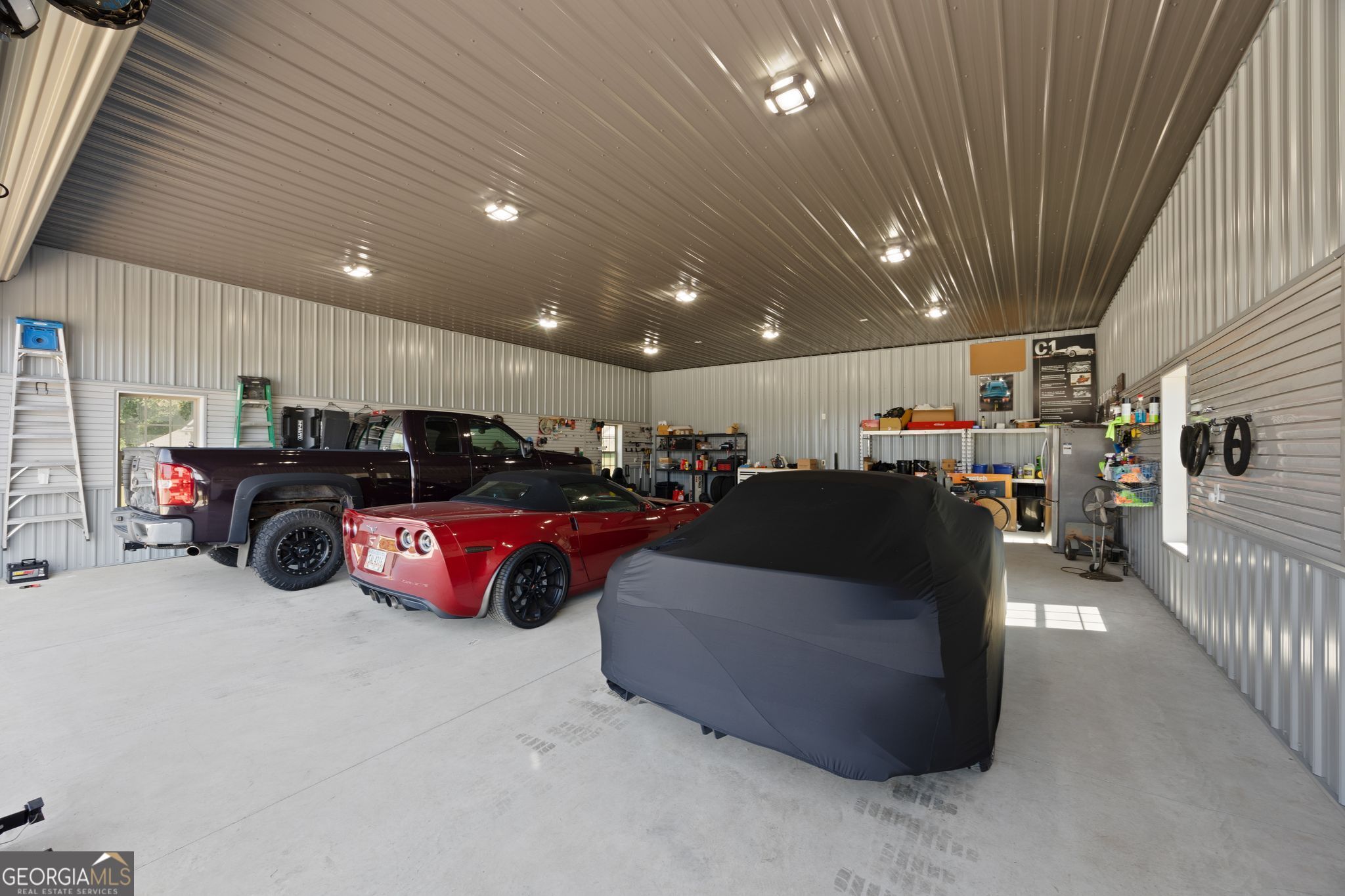 107 Sweet Bay Circle Milner, GA 30257 - Photo 31 of 31 a living room with lots of furniture and a projector