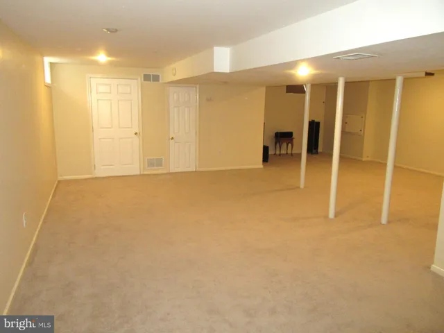 a view of an empty room with a bathroom