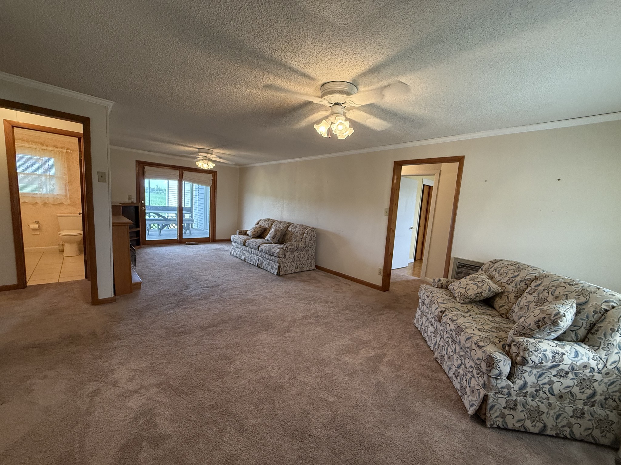 2971 Monroe Floyd Road Decherd, TN 37324 - Photo 10 of 26 a living room with furniture and a chandelier