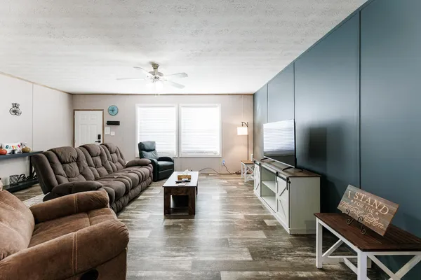 a living room with furniture and a flat screen tv