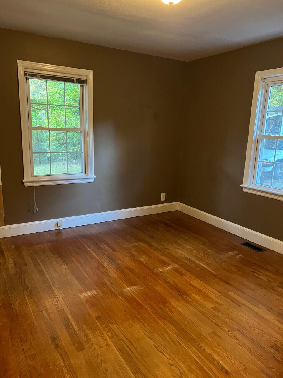 1523 Bore Auger Road Blue Ridge, VA 24064 - Photo 11 of 34 an empty room with wooden floor and windows