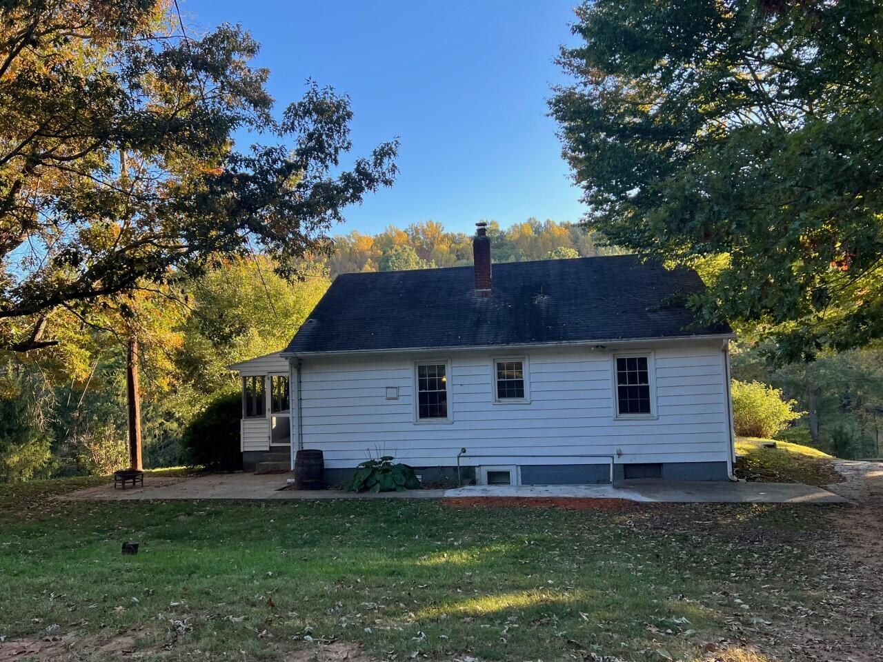 1523 Bore Auger Road Blue Ridge, VA 24064 - Photo 19 of 34 a front view of a house with a garden