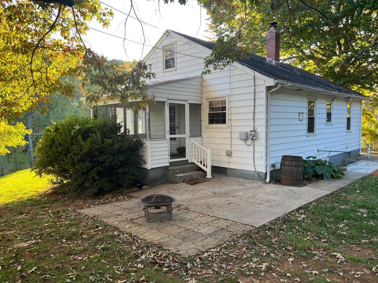 1523 Bore Auger Road Blue Ridge, VA 24064 - Photo 21 of 34 a view of a house with a yard