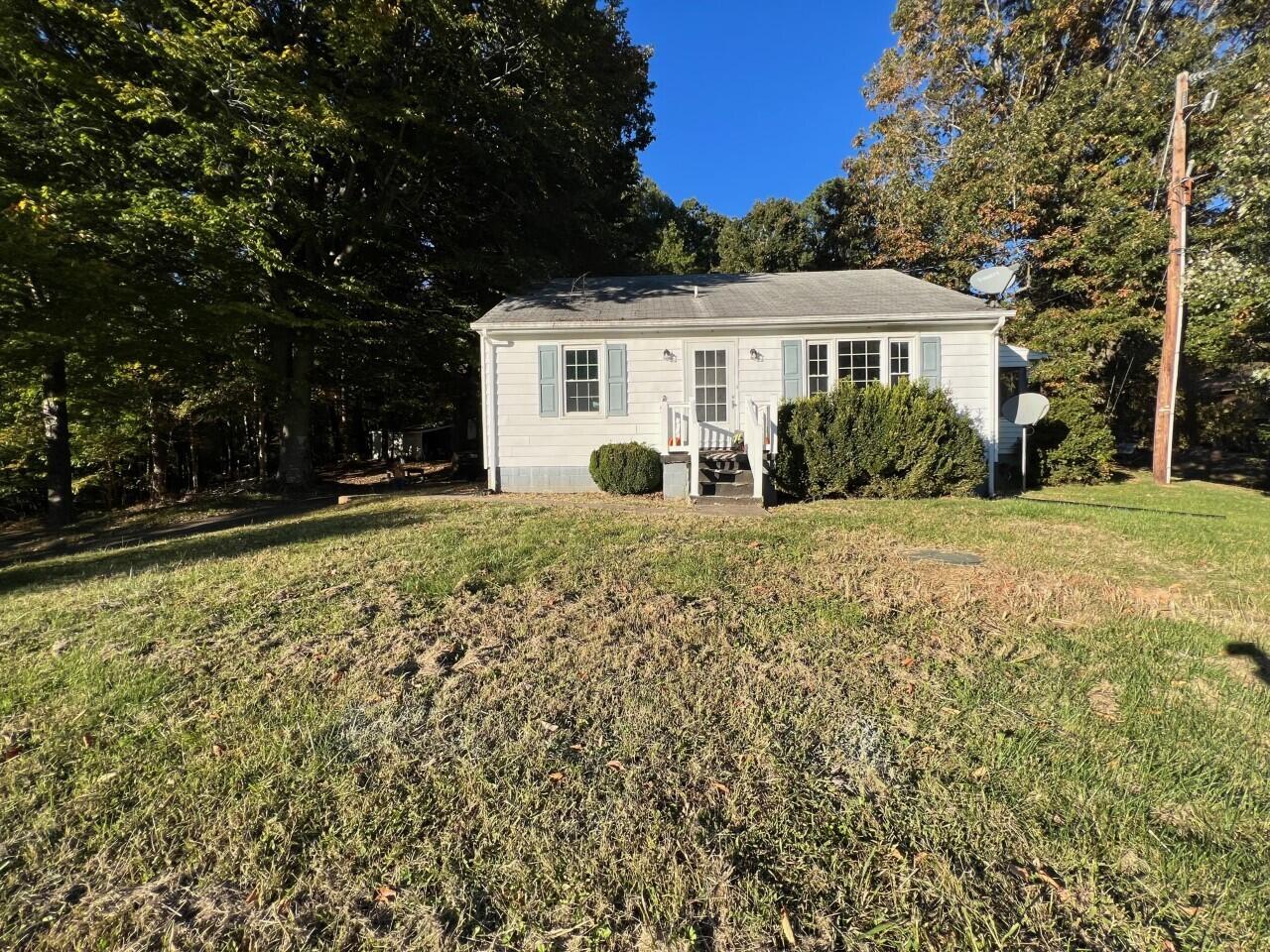 1523 Bore Auger Road Blue Ridge, VA 24064 - Photo 4 of 34 a front view of a house with a yard