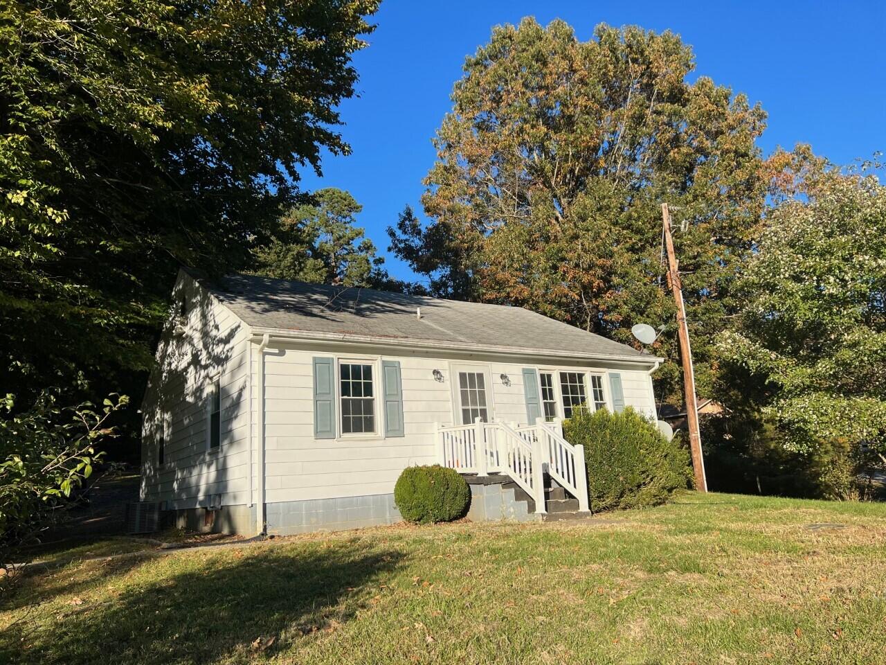1523 Bore Auger Road Blue Ridge, VA 24064 - Photo 5 of 34 a front view of a house with a yard