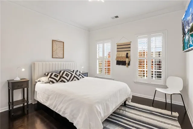 a bedroom with a bed and a chair