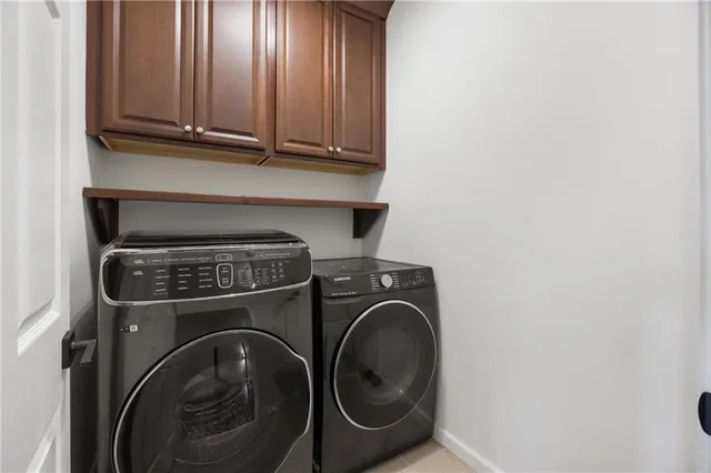 a bathroom with a sink a toilet a mirror and shower