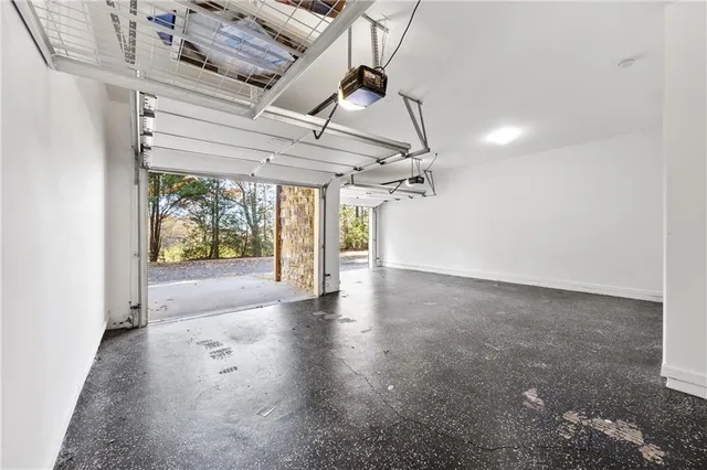 an empty room with a ceiling fan and window