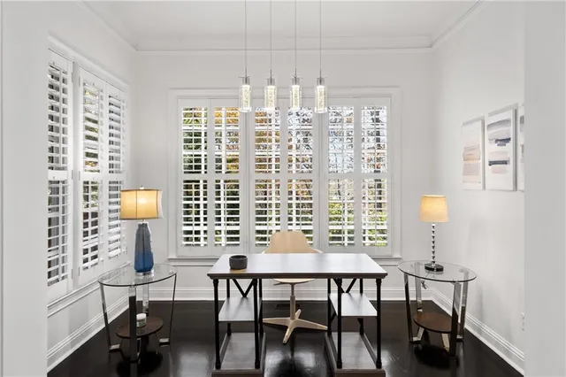 a view of a dining room with furniture and a window