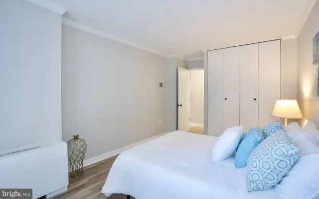 a bedroom with a bed and a chair