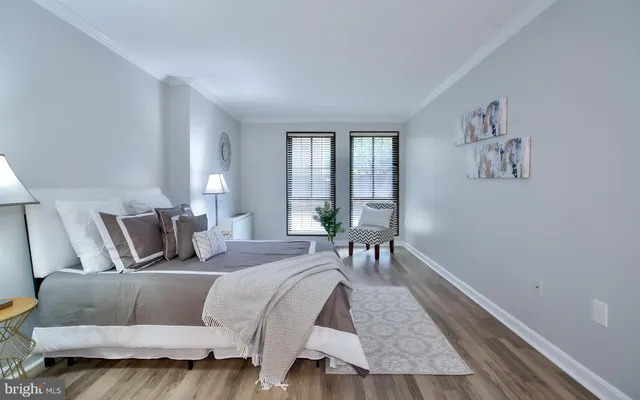 a bed room with a bed and a chair