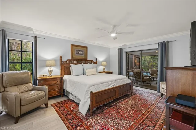 a bedroom with a bed couch and a window