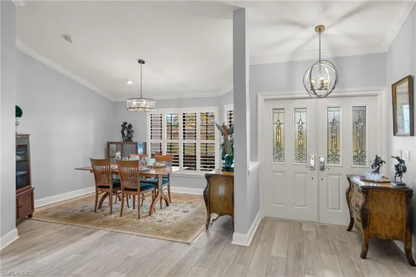 a view of a dining room with furniture window and wooden floor