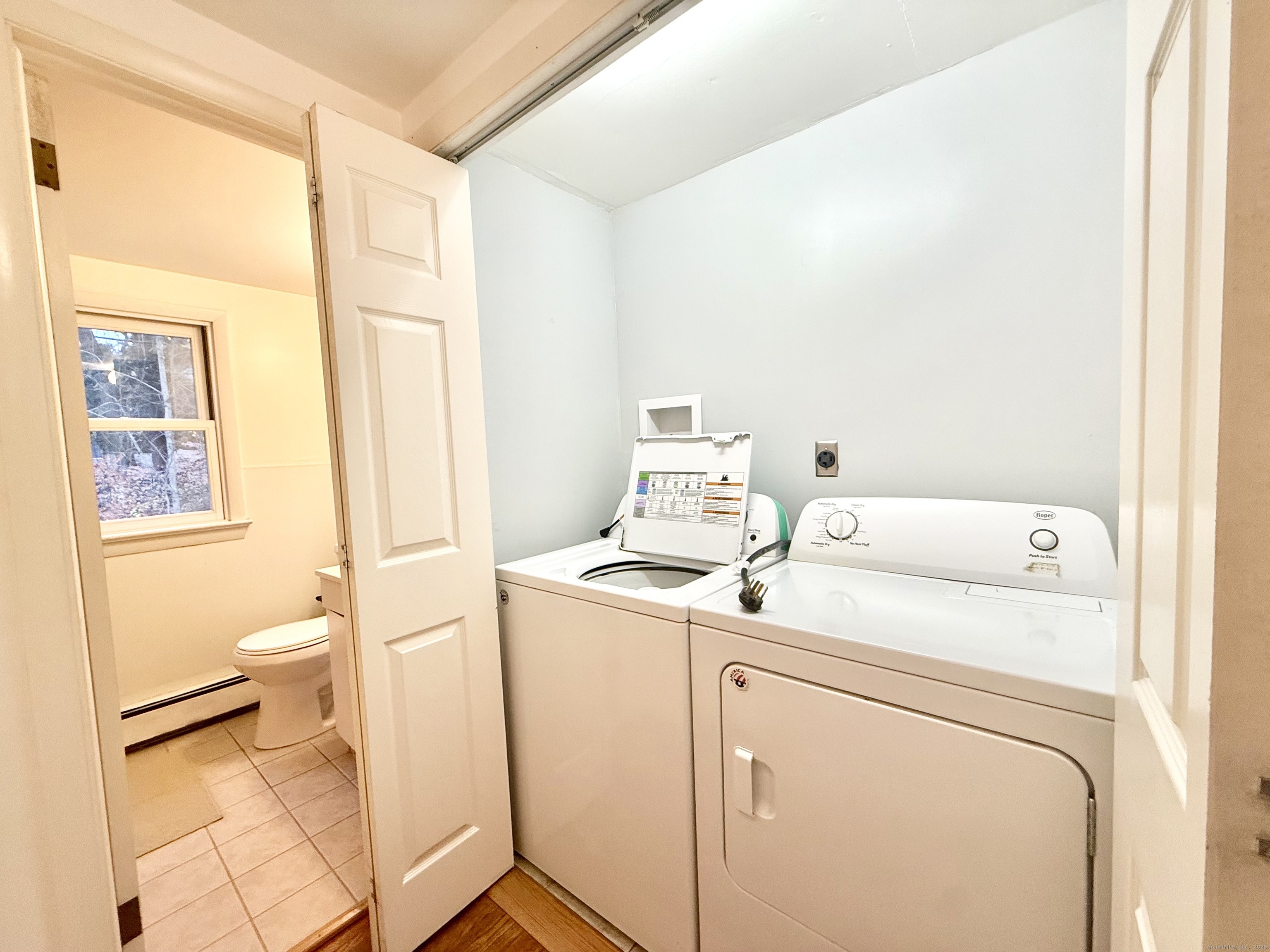 213 Georgetown Road Weston, CT 06883 - Photo 11 of 24 a utility room with dryer and washer