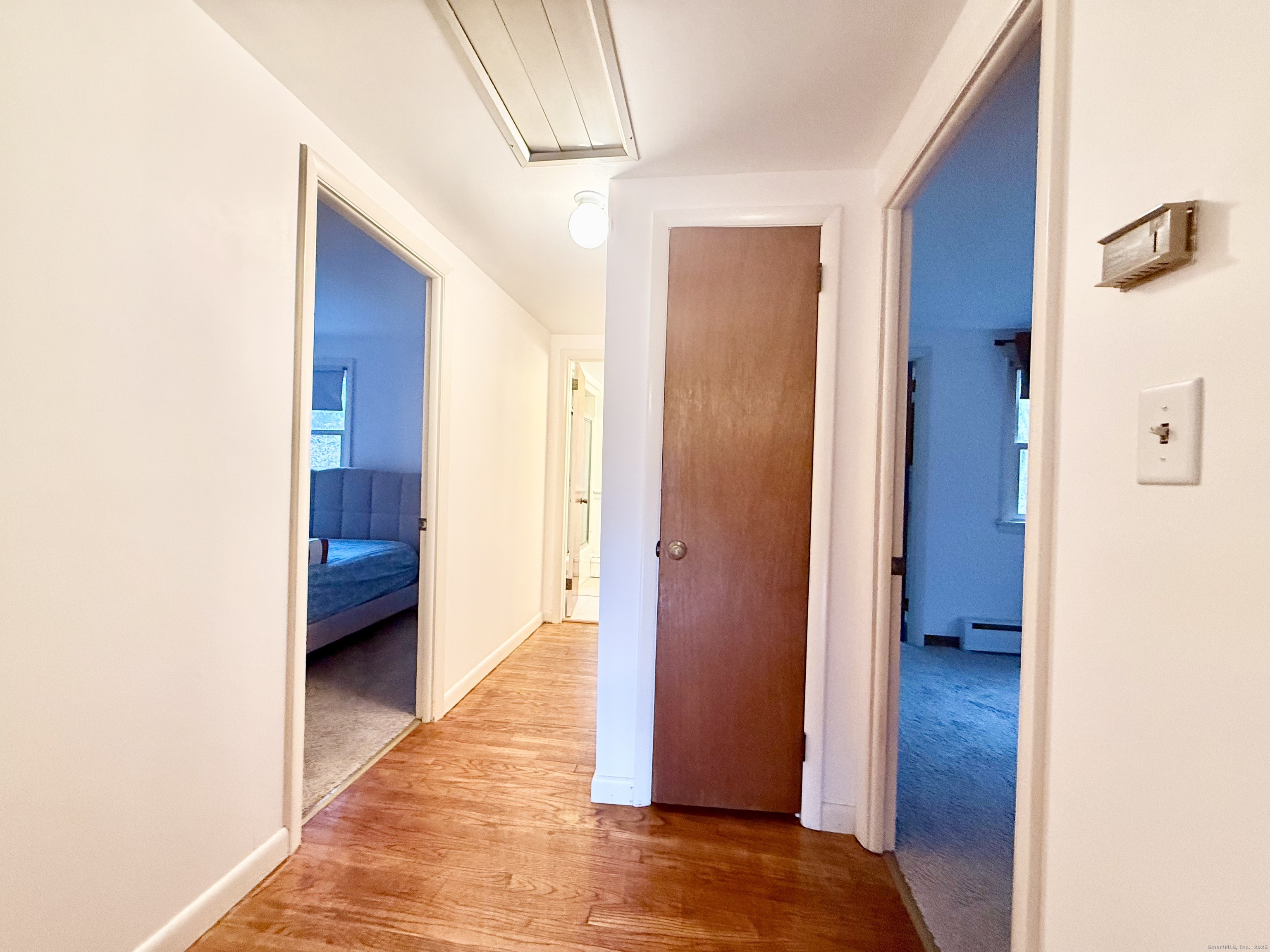 213 Georgetown Road Weston, CT 06883 - Photo 12 of 24 a view of a hallway with an entryway and staircase