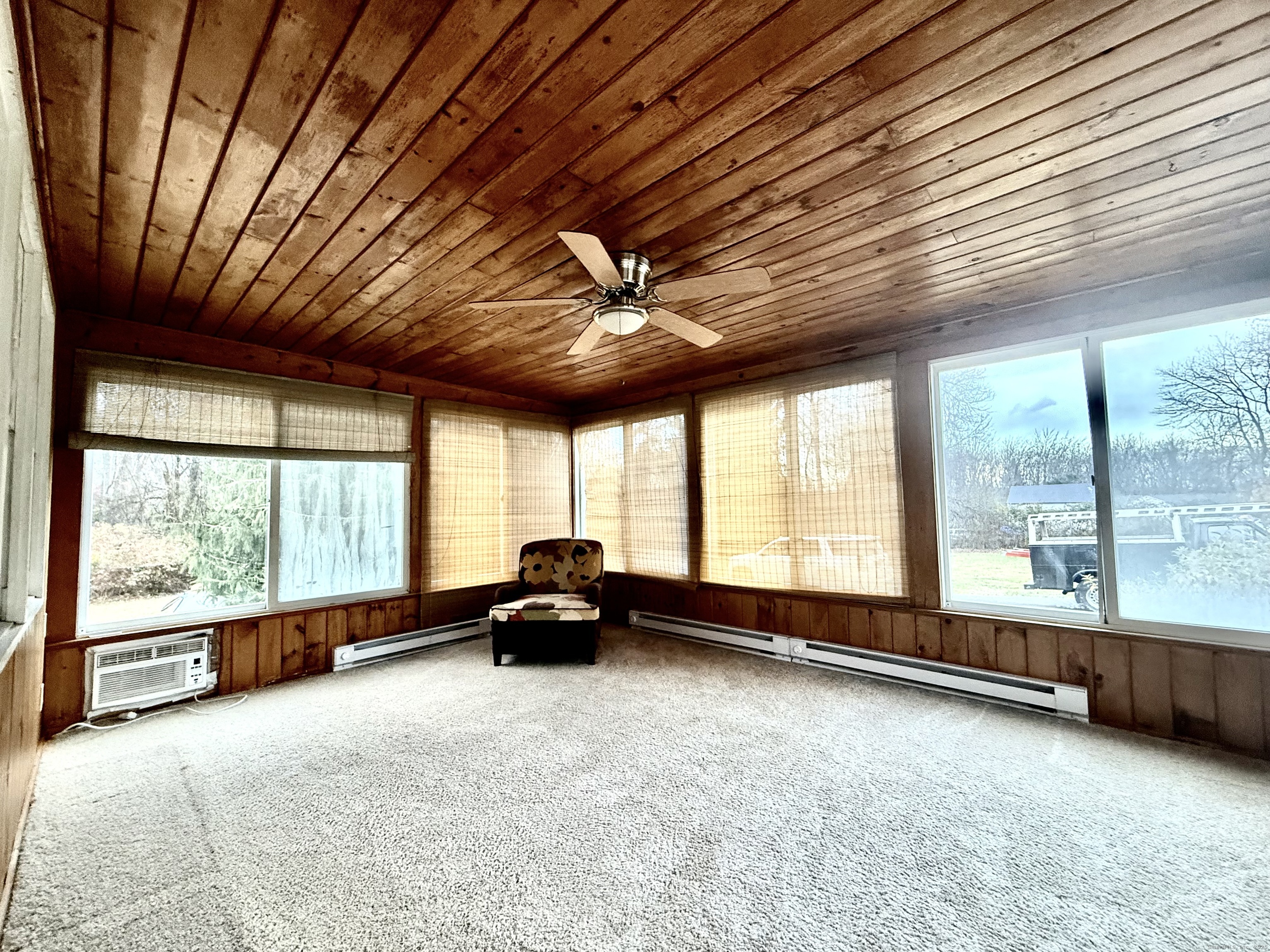 213 Georgetown Road Weston, CT 06883 - Photo 14 of 24 a living room with furniture and a large window
