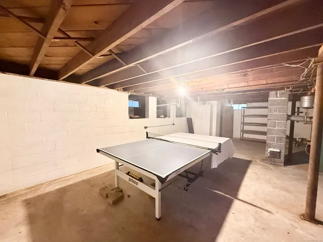 a room with table tennis table and windows