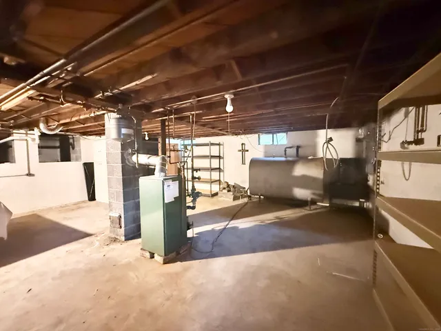 a view of a garage with wooden shelves