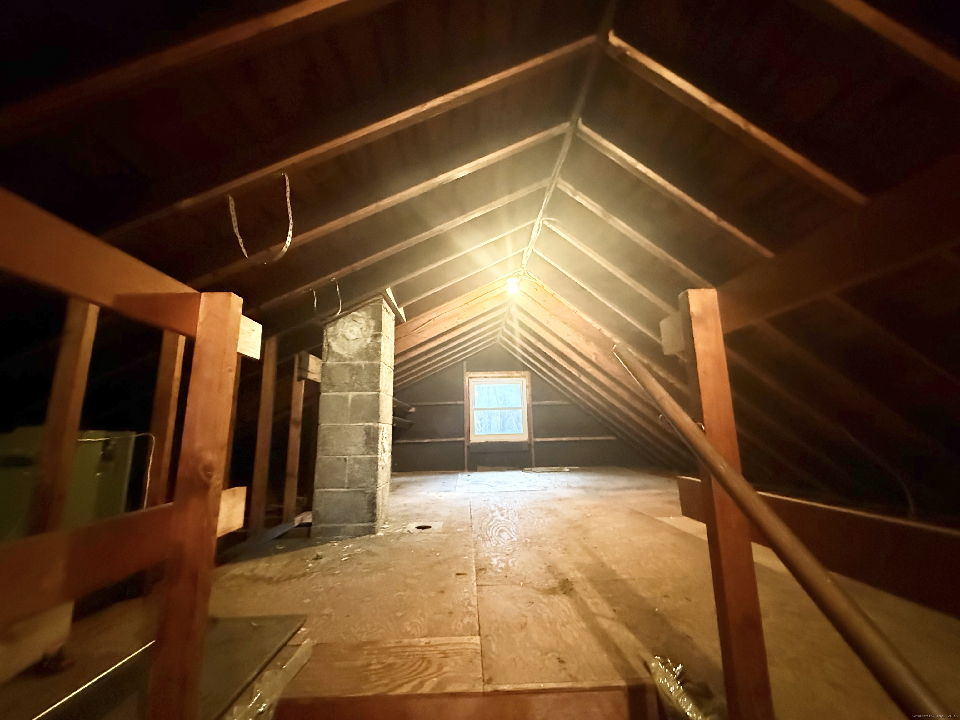 213 Georgetown Road Weston, CT 06883 - Photo 17 of 24 a view of a hallway with wooden walls and floor