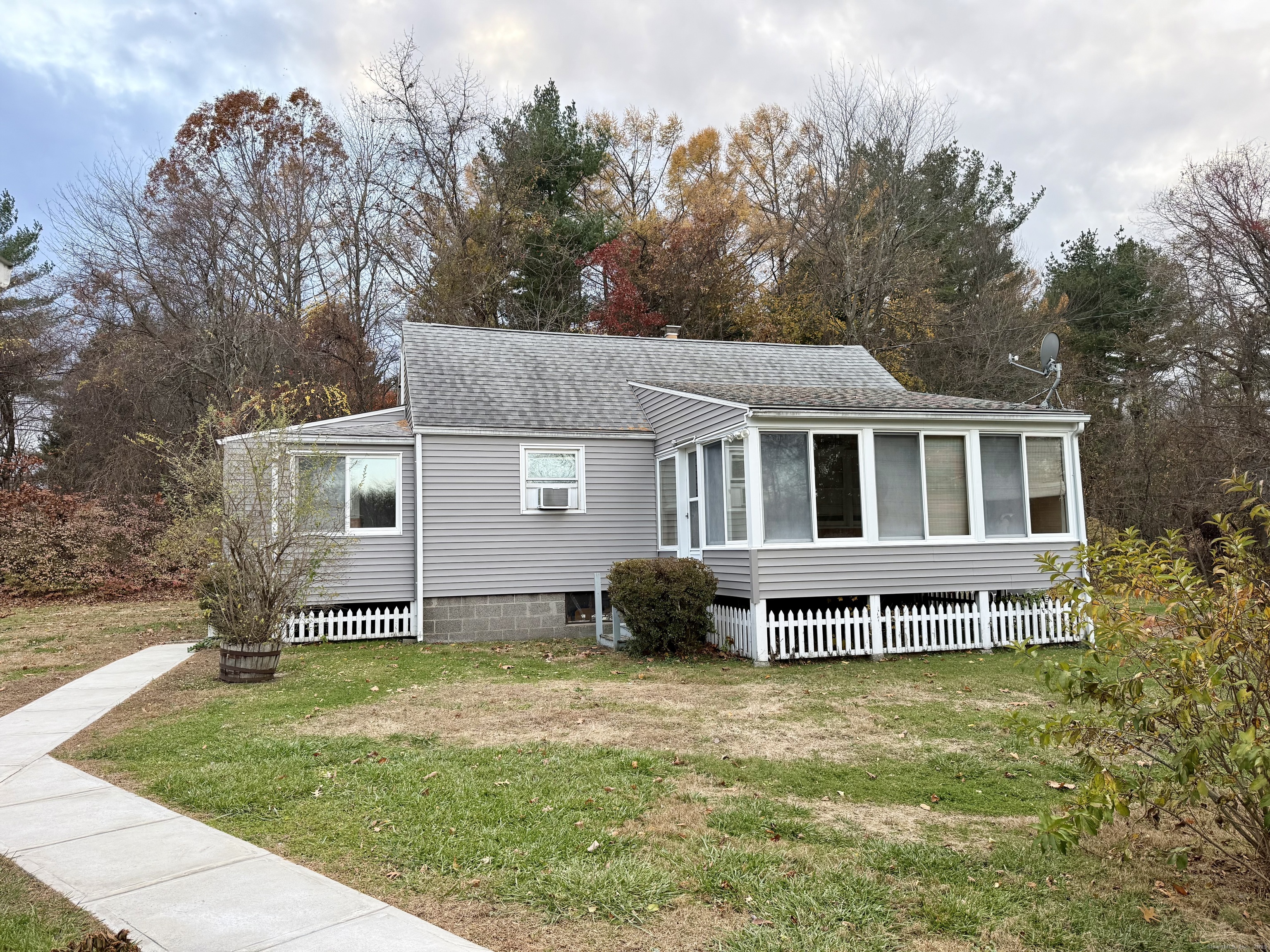 213 Georgetown Road Weston, CT 06883 - Photo 19 of 24 a front view of a house with a garden