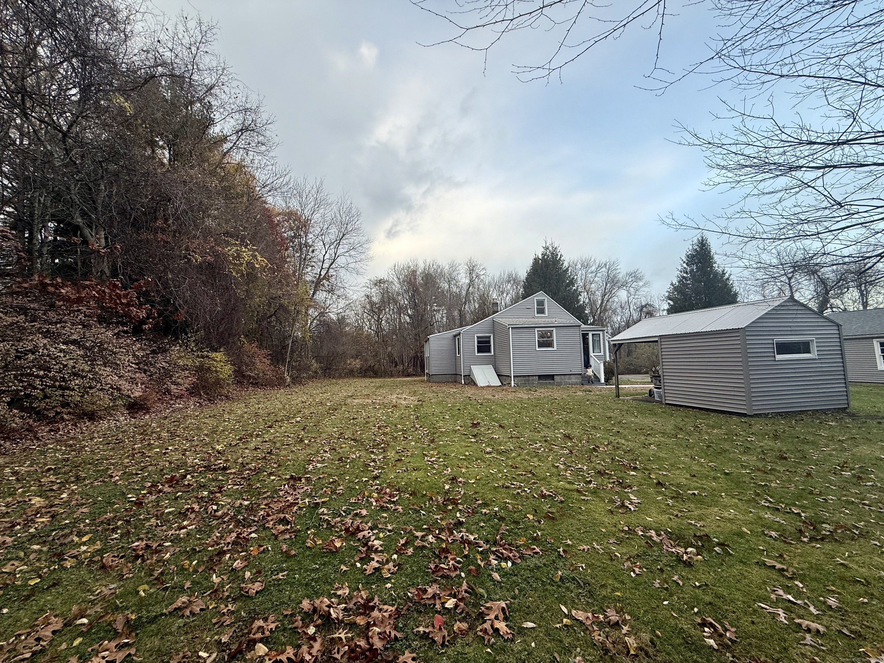 213 Georgetown Road Weston, CT 06883 - Photo 20 of 24 a view of a house with a yard