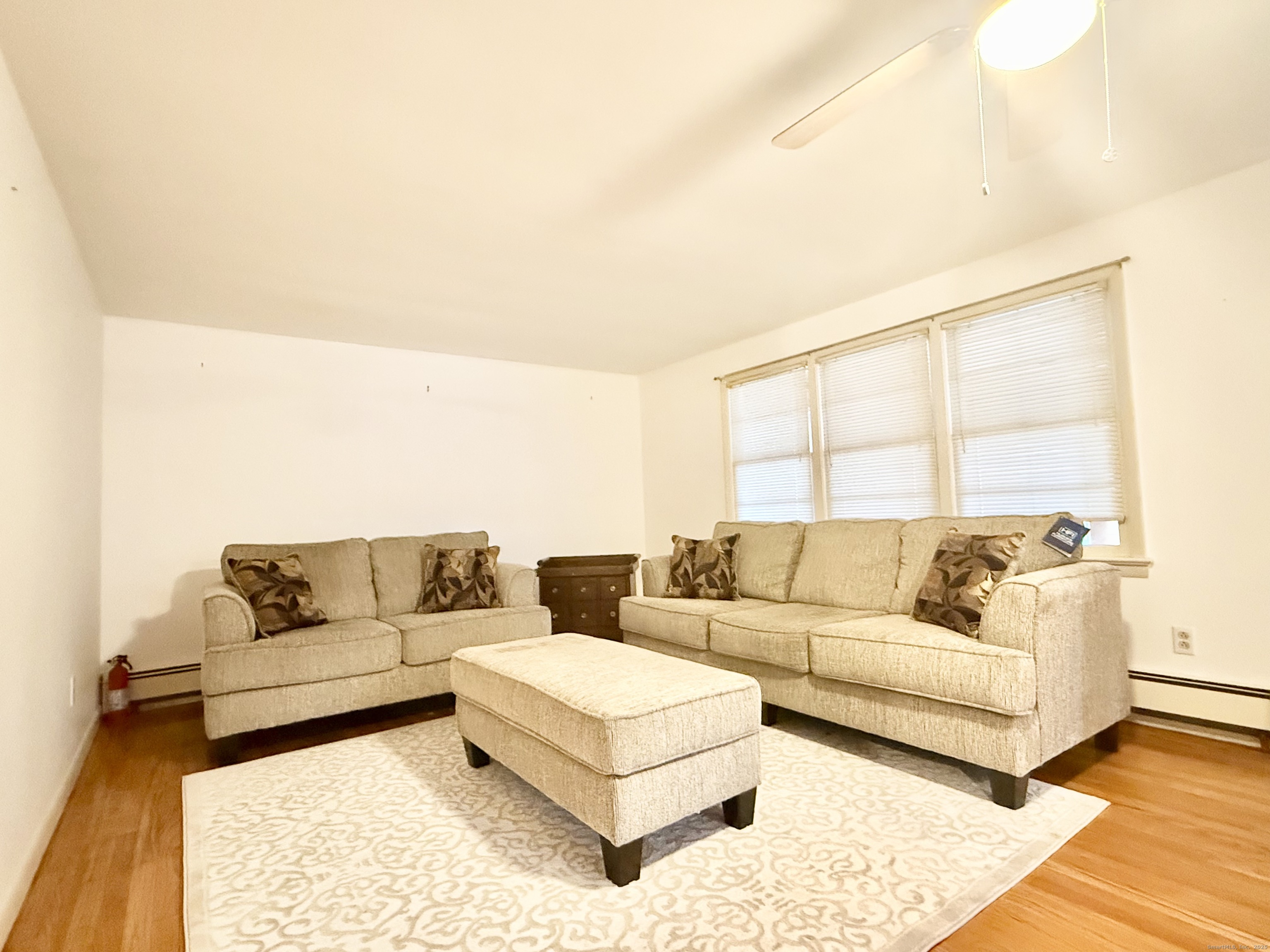 213 Georgetown Road Weston, CT 06883 - Photo 2 of 24 a living room with furniture and a large window