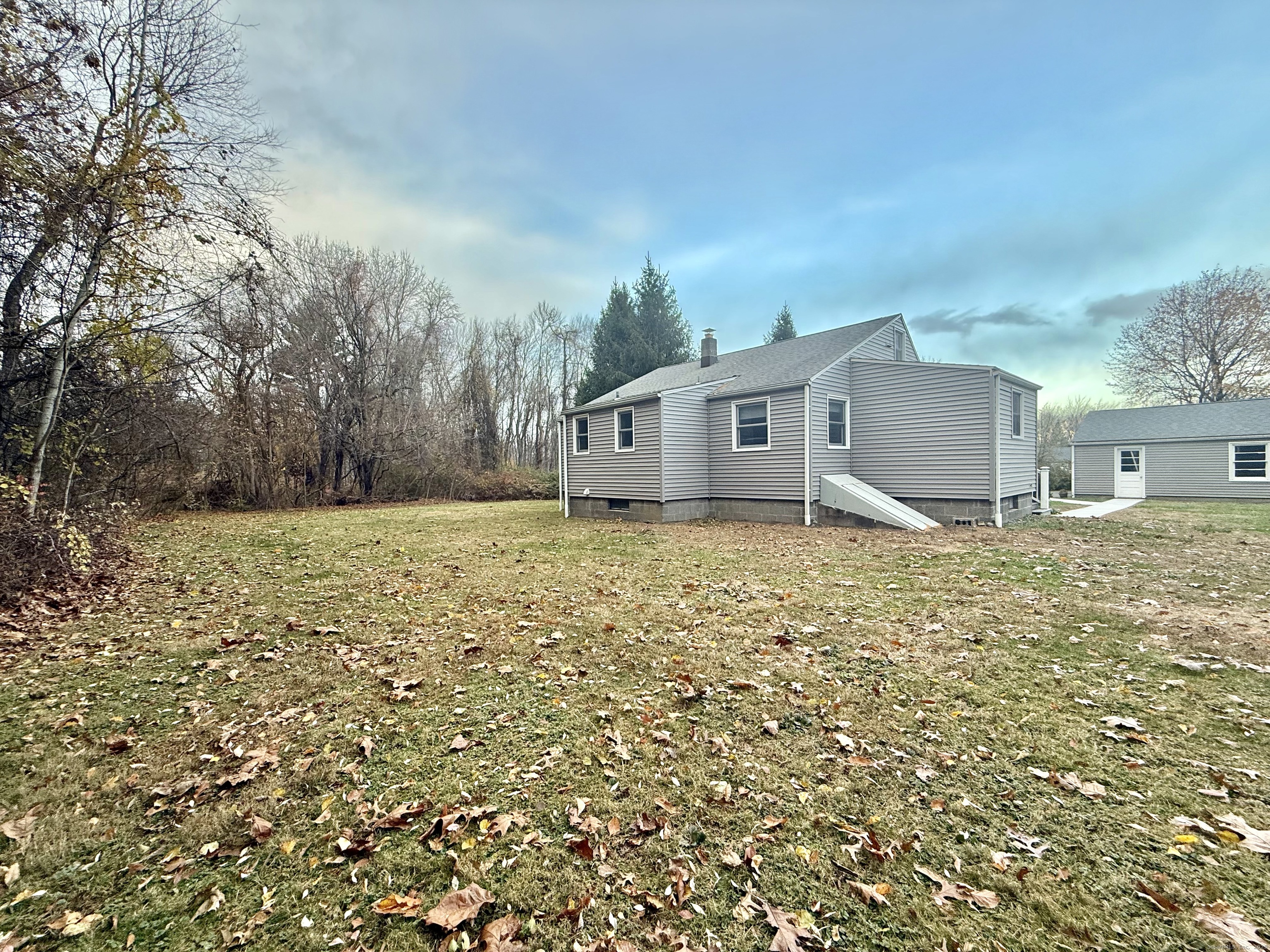 213 Georgetown Road Weston, CT 06883 - Photo 21 of 24 a house view with a outdoor space