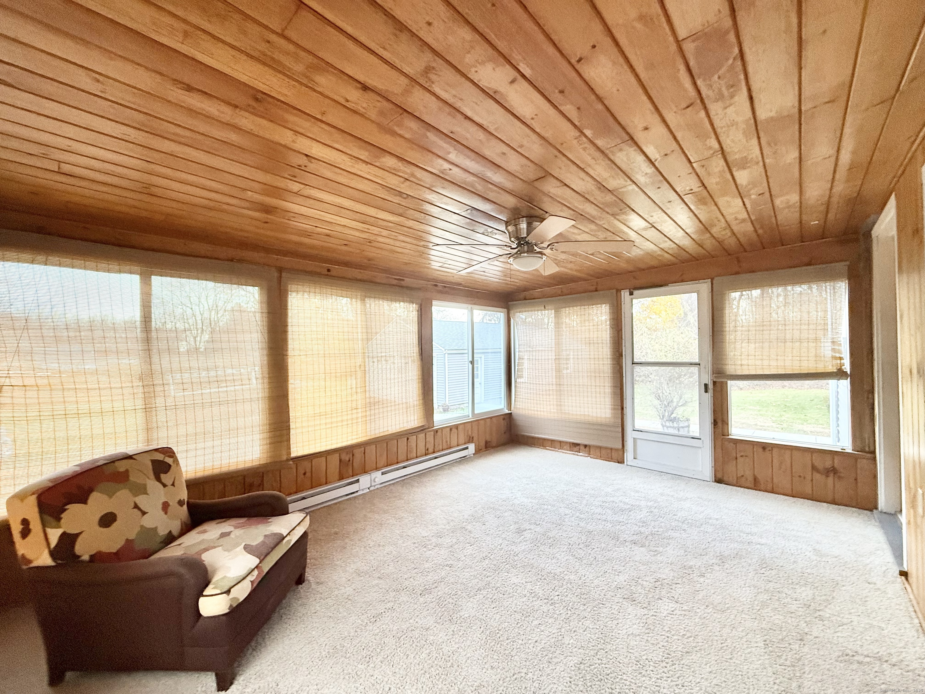 213 Georgetown Road Weston, CT 06883 - Photo 7 of 24 a living room with furniture and a large window