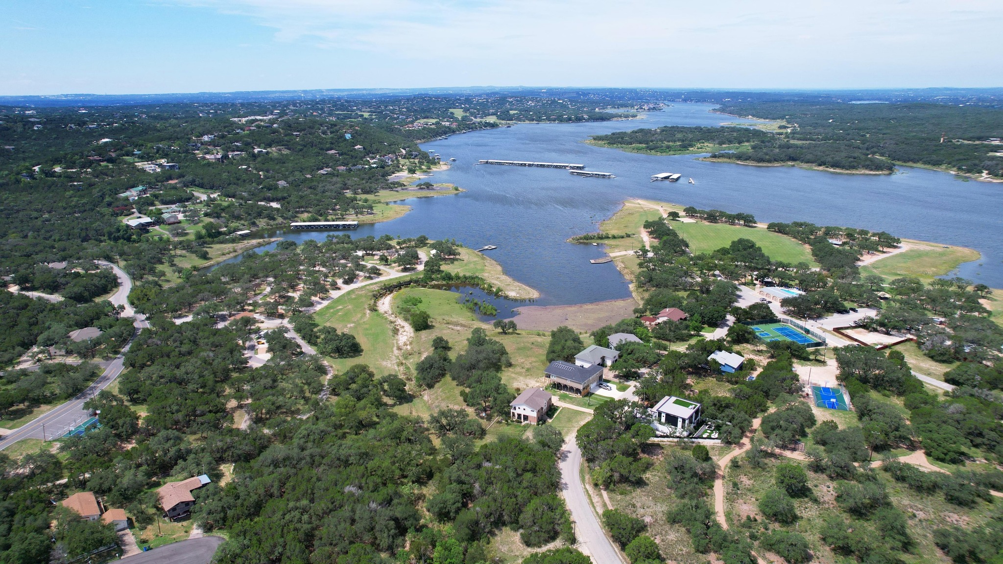 6719 Bar K Ranch Road Lago Vista, TX 78645 - Photo 18 of 36 an aerial view of a house with a yard