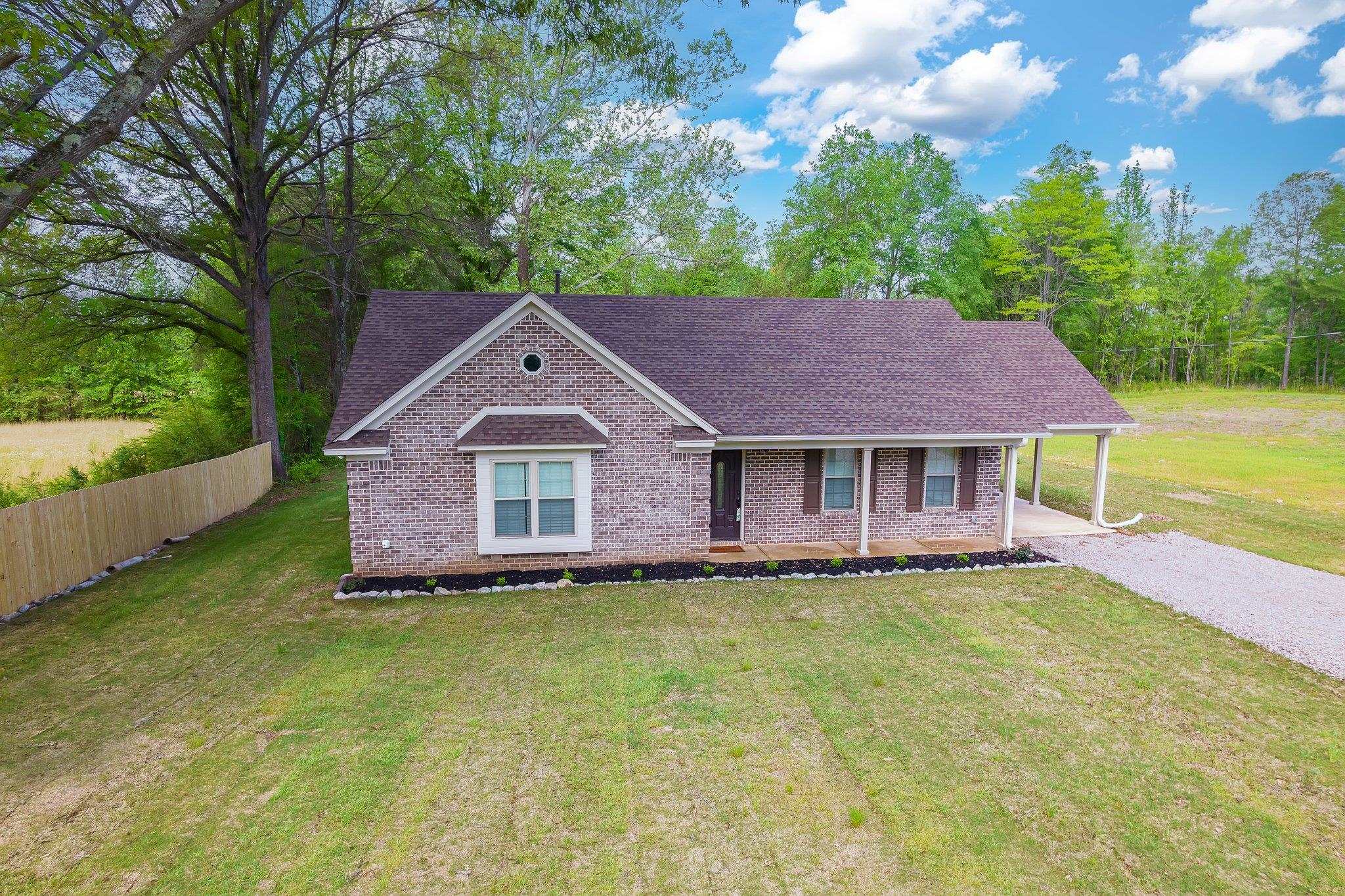 461 Summit Lane Stanton, TN 38069 - Photo 18 of 30 a house with garden in front of it