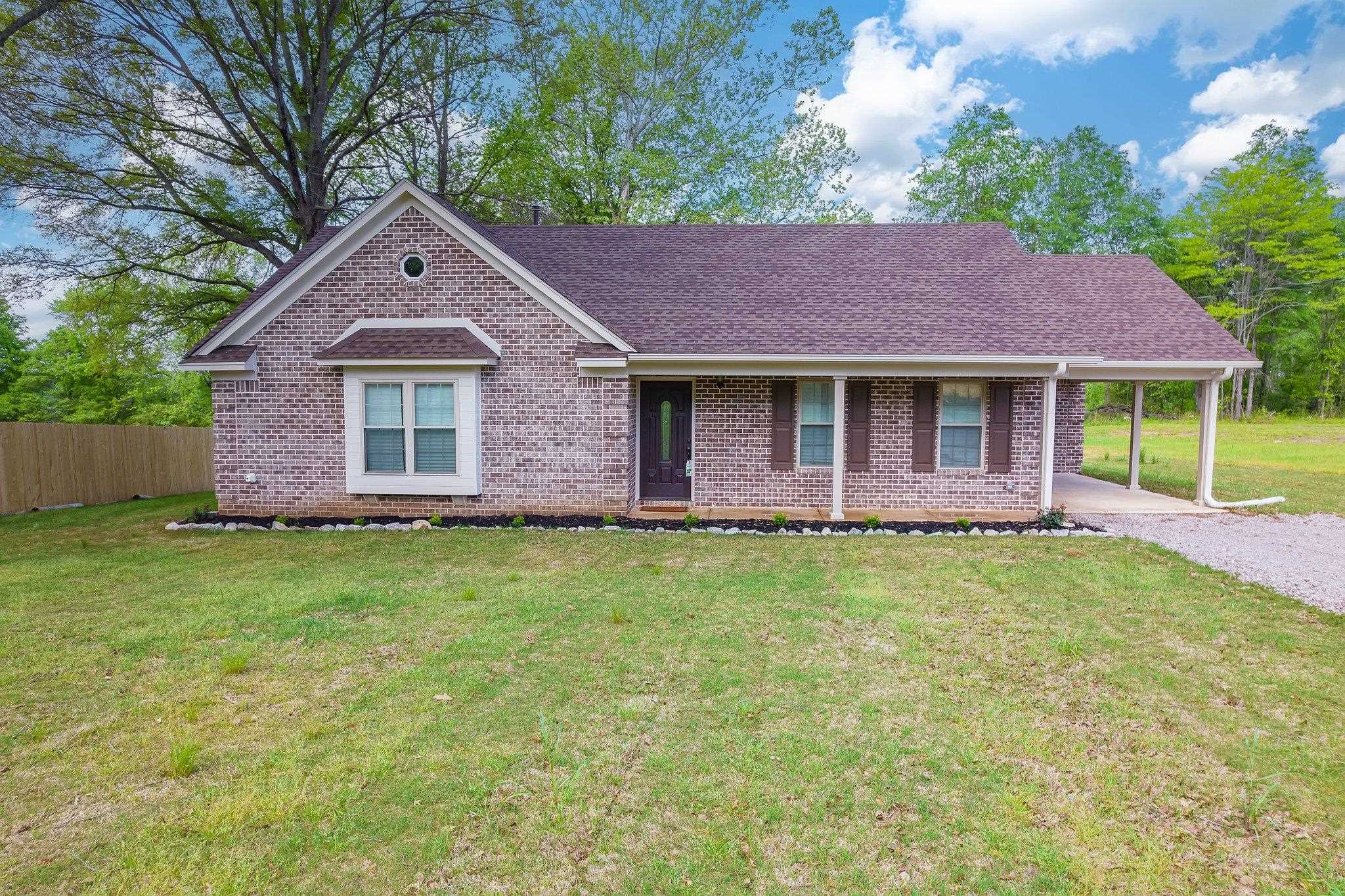 461 Summit Lane Stanton, TN 38069 - Photo 3 of 30 a front view of a house with a garden