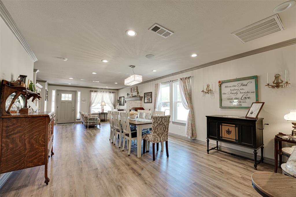 521 Bakers Branch Road Waxahachie, TX 75167 - Photo 8 of 37 Spacious open-concept living area featuring wood-finish flooring, recessed lighting, and a front entry door with glass inserts