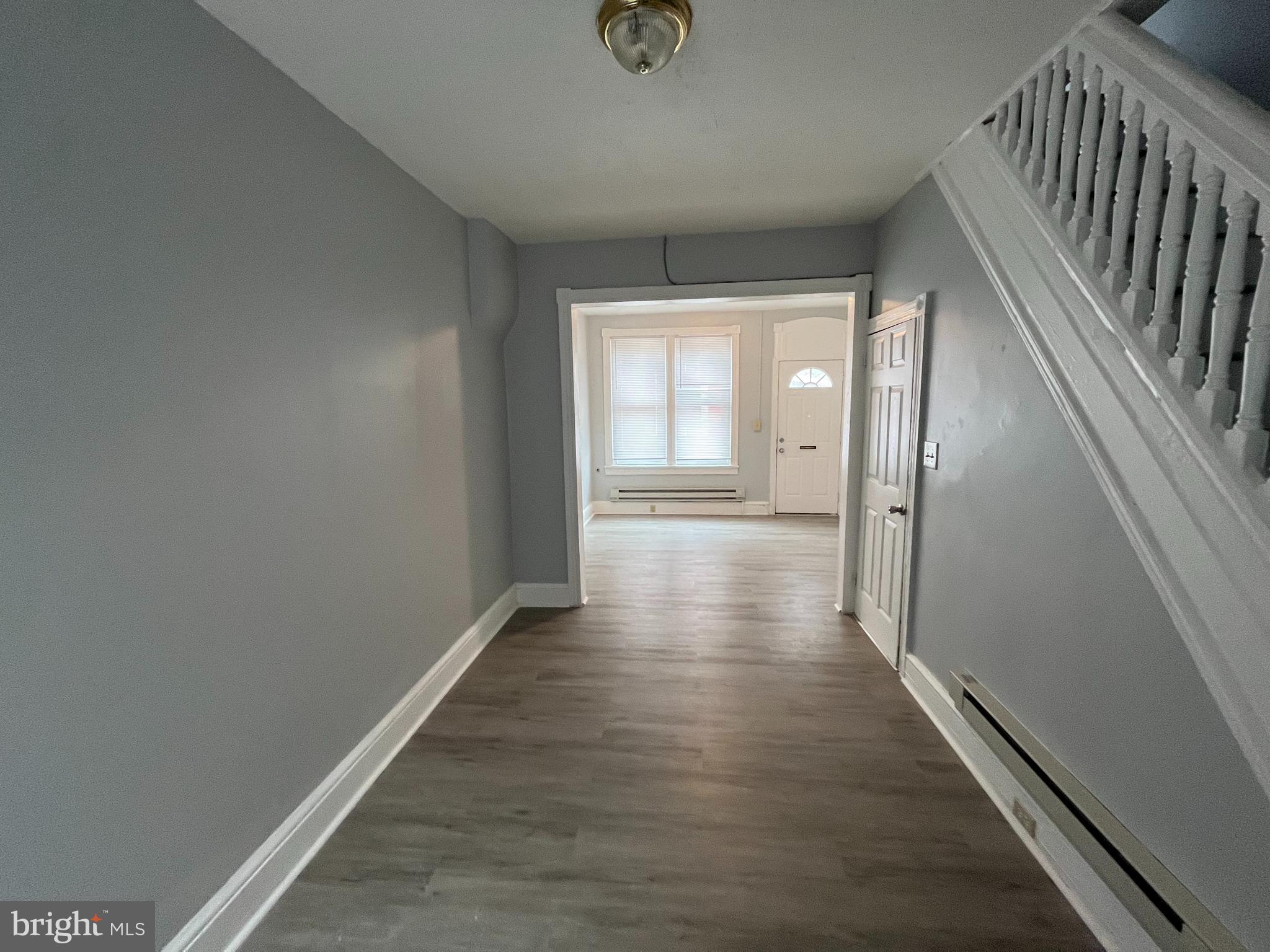 518 Johnson Street Reading, PA 19601 - Photo 3 of 5 a view of hallway with wooden floor