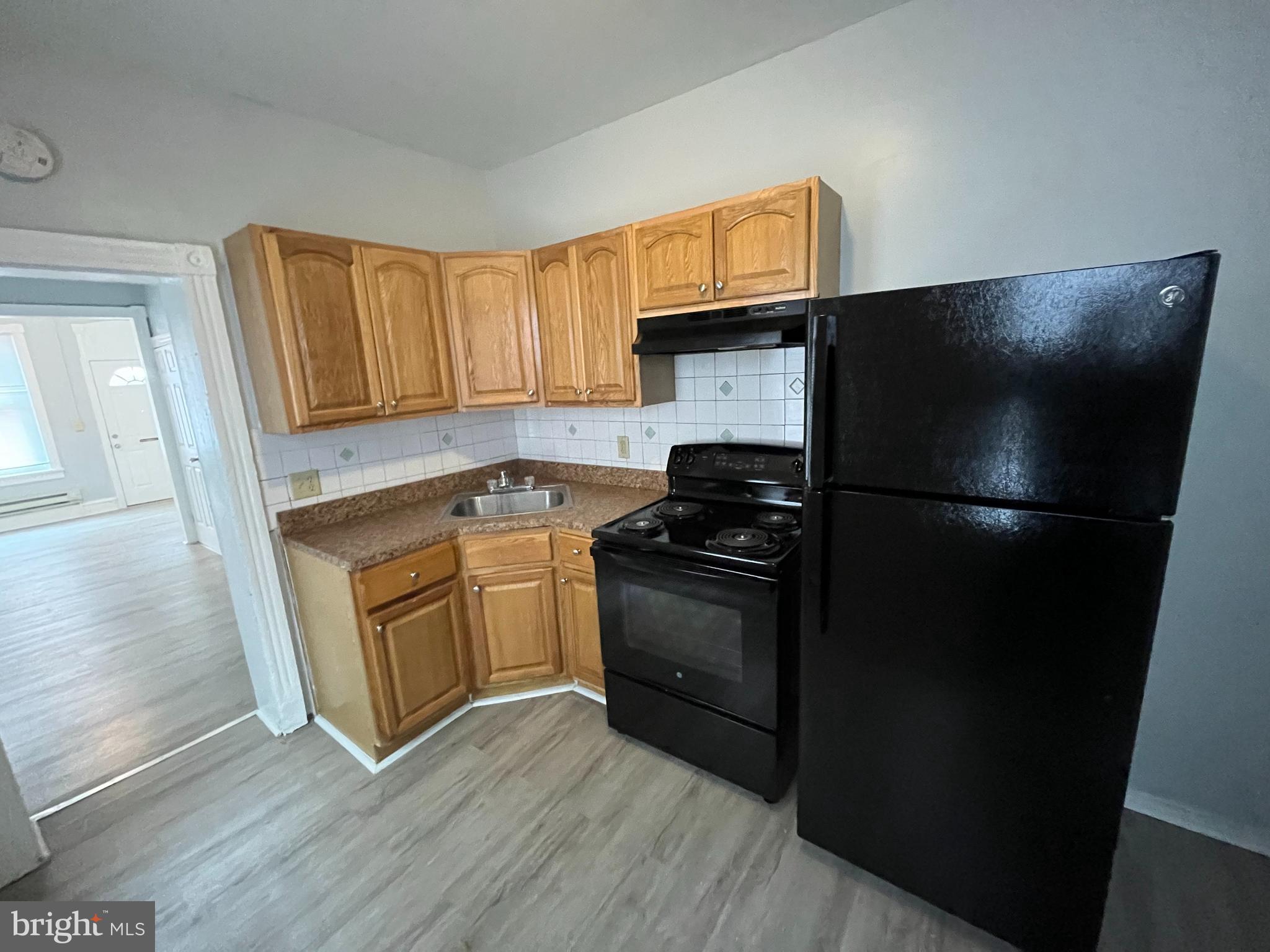 518 Johnson Street Reading, PA 19601 - Photo 4 of 5 a kitchen with a refrigerator and a sink
