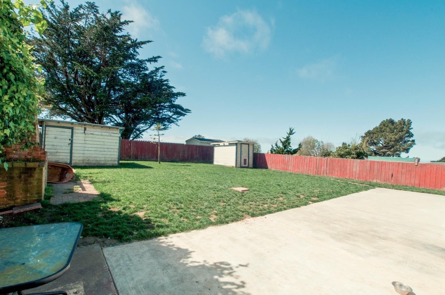 472 Inverness Drive Pacifica, CA 94044 - Photo 19 of 22 a view of a house with a backyard