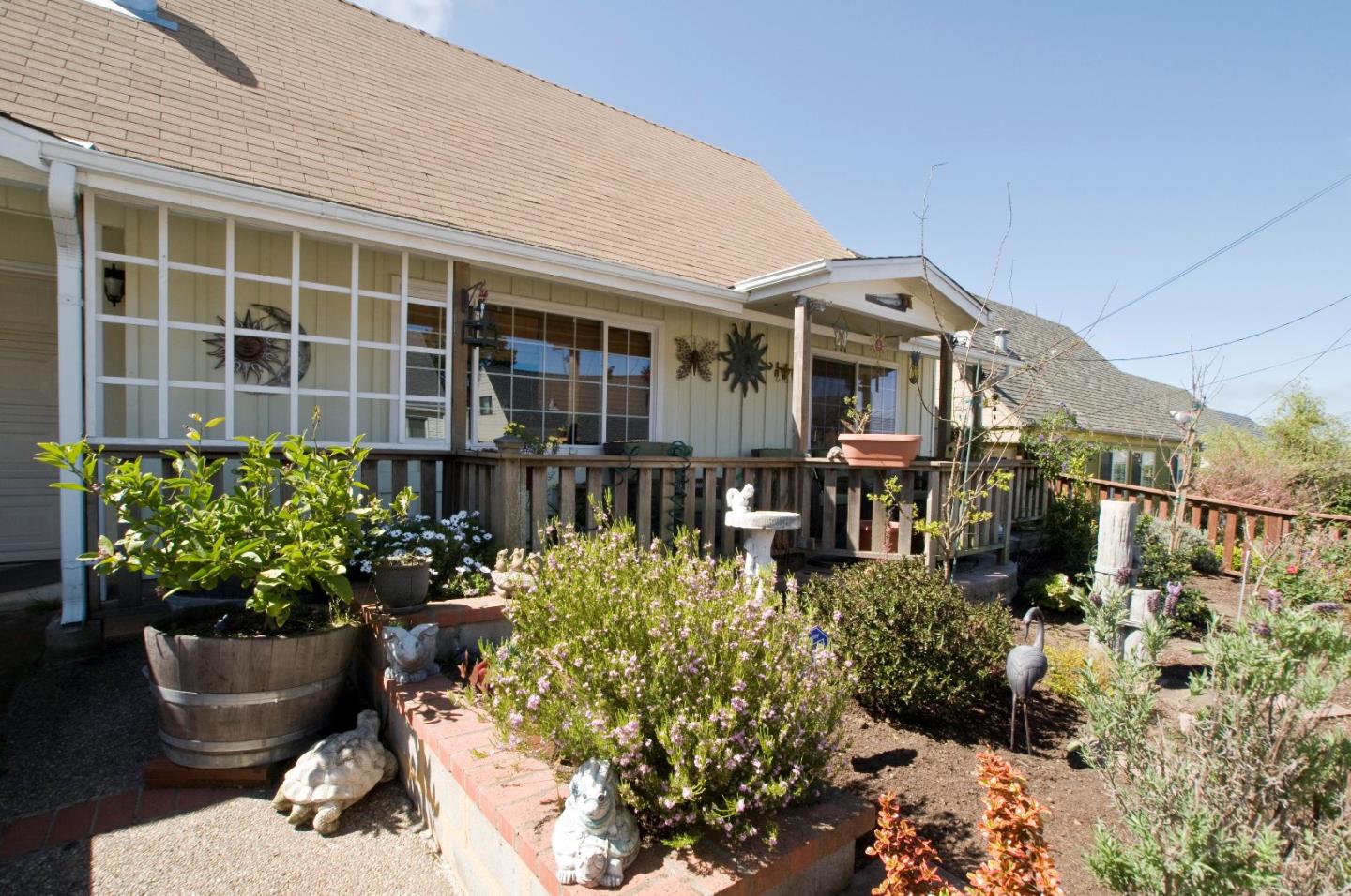 472 Inverness Drive Pacifica, CA 94044 - Photo 21 of 22 a front view of a house with a yard and potted plants
