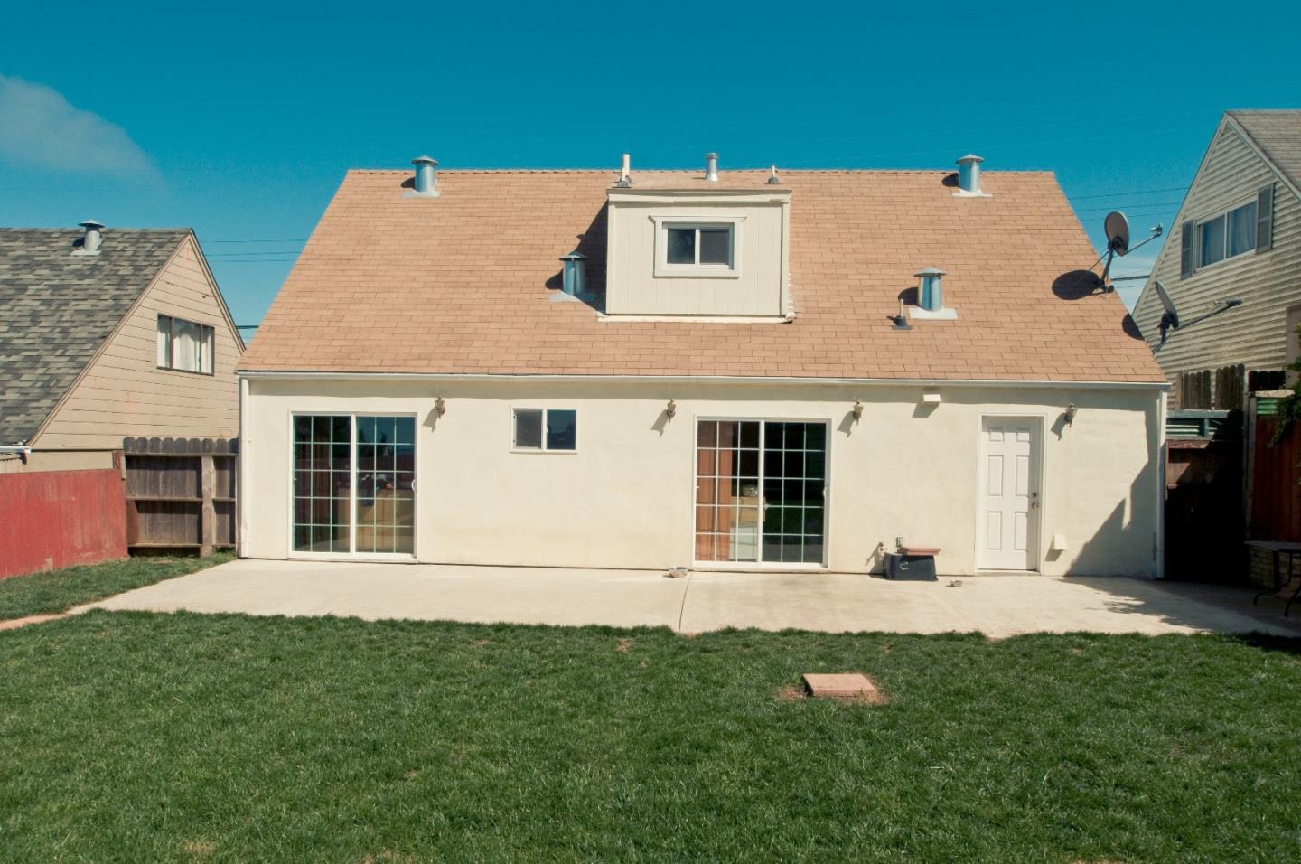 472 Inverness Drive Pacifica, CA 94044 - Photo 4 of 22 a view of a house with backyard and garden