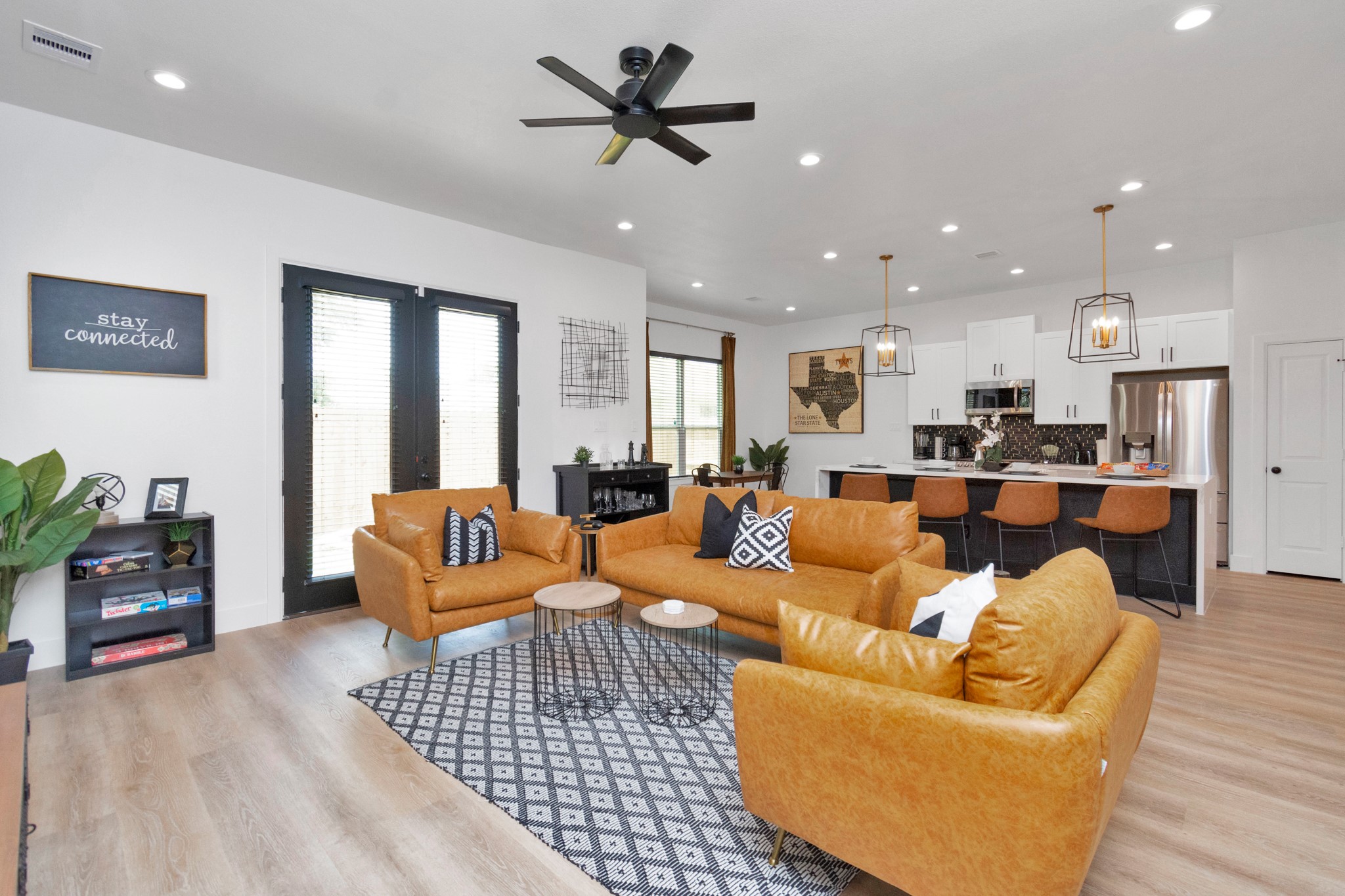 5308 Denmark Street Houston, TX 77028 - Photo 2 of 36 a living room with furniture kitchen view and a wooden floor