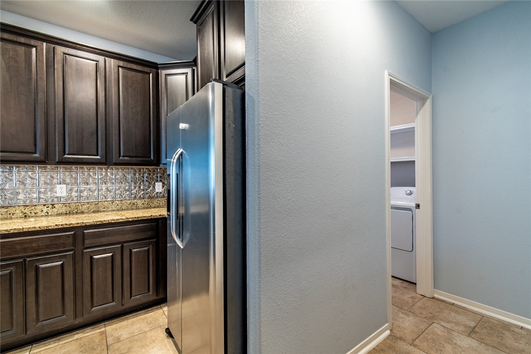 316 San Jose Street Portland, TX 78374 - Photo 13 of 35 a view of granite countertop cabinets and stainless steel appliances