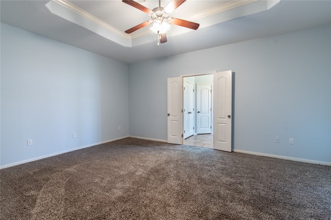 316 San Jose Street Portland, TX 78374 - Photo 14 of 35 an empty room with closet and a chandelier fan