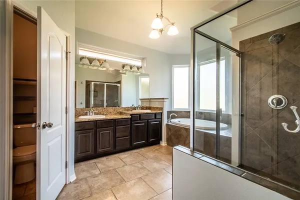 a bathroom with a bathtub and shower