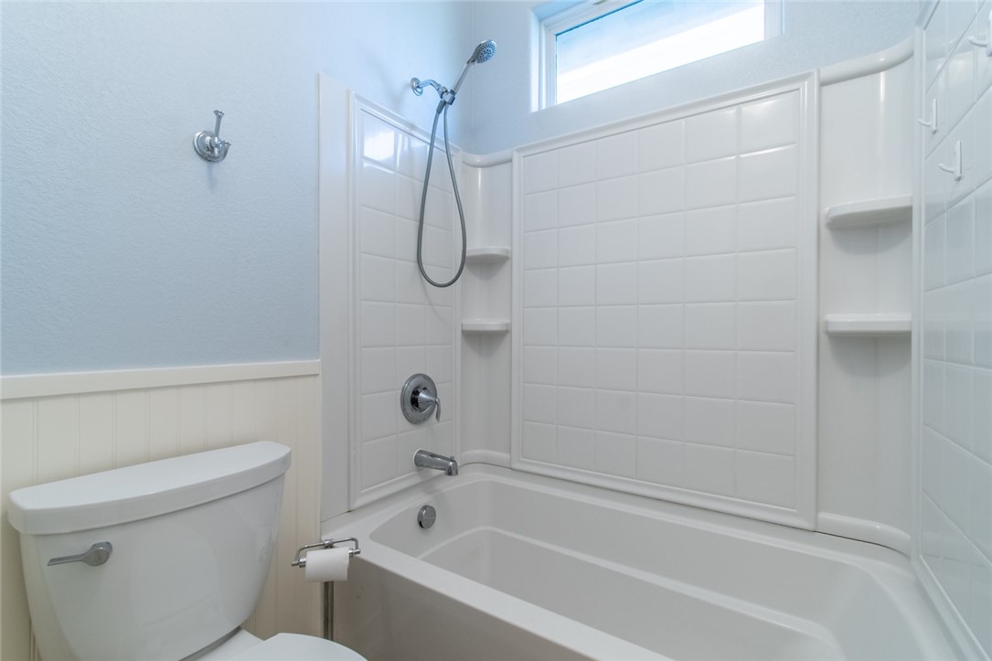 316 San Jose Street Portland, TX 78374 - Photo 22 of 35 a bathroom with a shower and a toilet