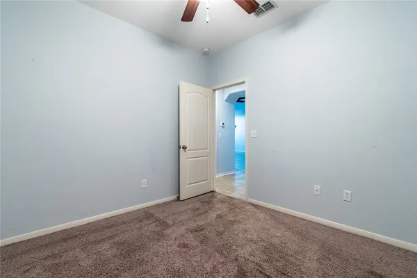 an empty room with closet area