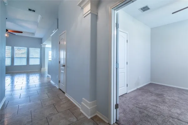 a view of workspace with window and a ceiling fan