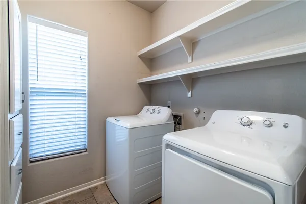 a view of a porch with furniture and a backyard