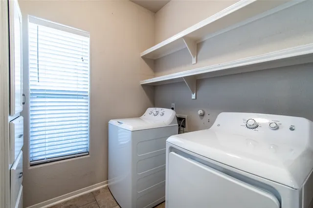 a view of a porch with furniture and a backyard