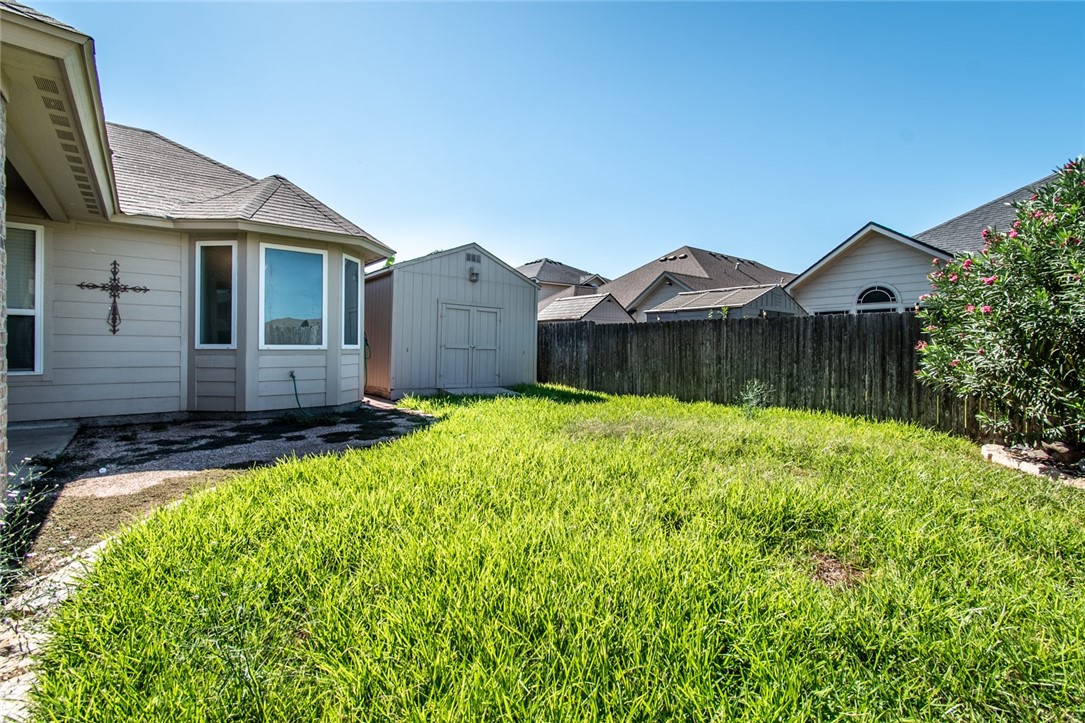 316 San Jose Street Portland, TX 78374 - Photo 34 of 35 a front view of a house with a yard